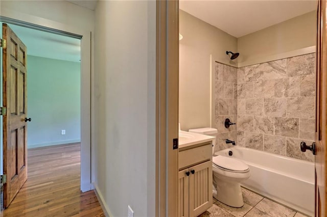 full bathroom featuring vanity, toilet, and tub / shower combination