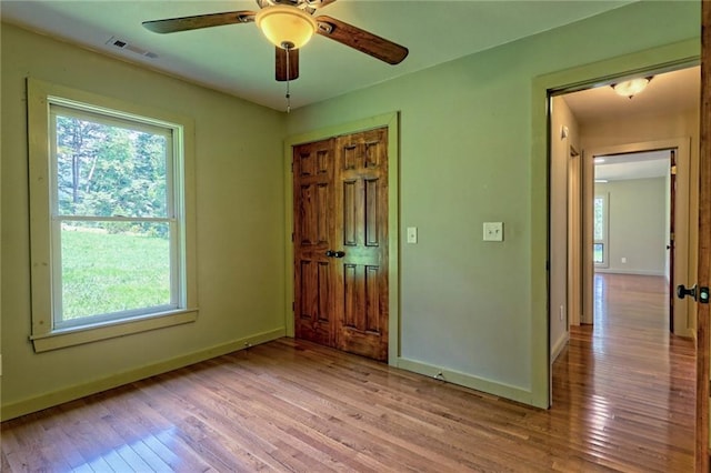 interior space with plenty of natural light, ceiling fan, and light hardwood / wood-style flooring