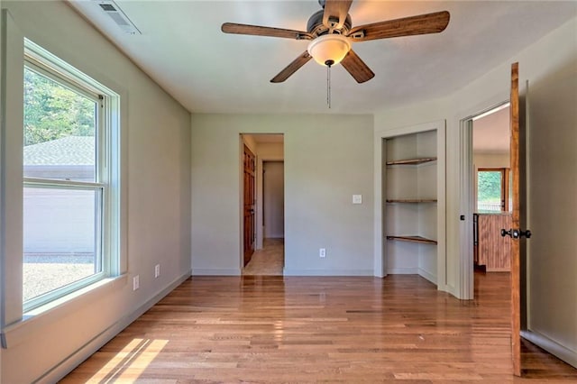 unfurnished bedroom with light hardwood / wood-style floors and ceiling fan