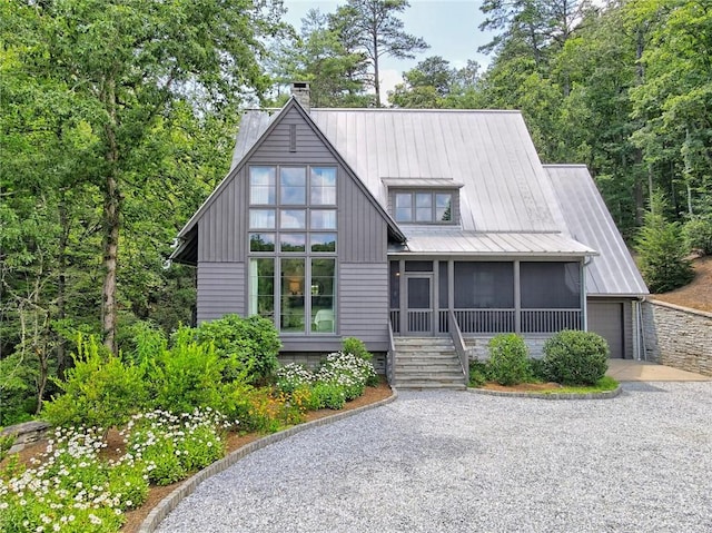 view of front facade with a sunroom and a garage