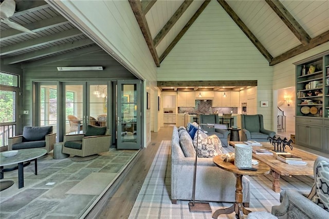 living room with hardwood / wood-style floors, beam ceiling, and high vaulted ceiling