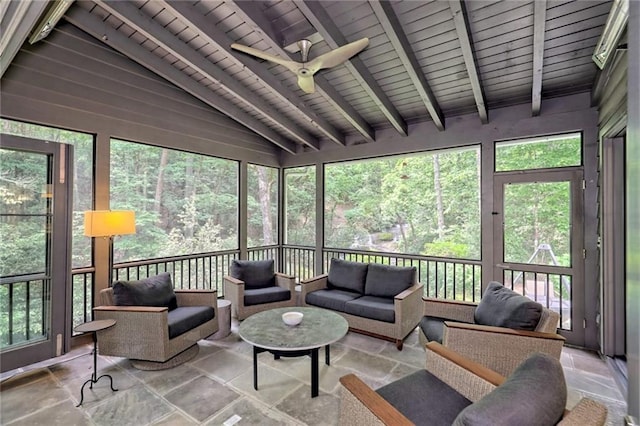 sunroom featuring vaulted ceiling with beams, ceiling fan, and wood ceiling