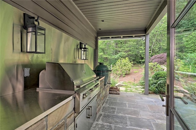 view of patio / terrace featuring area for grilling and exterior kitchen