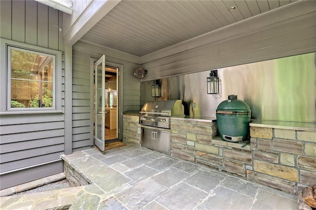 view of patio / terrace featuring area for grilling and an outdoor kitchen