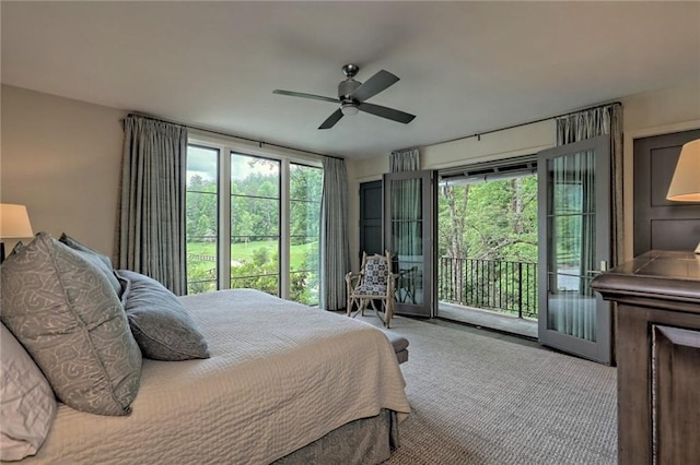 carpeted bedroom with ceiling fan, access to exterior, and multiple windows