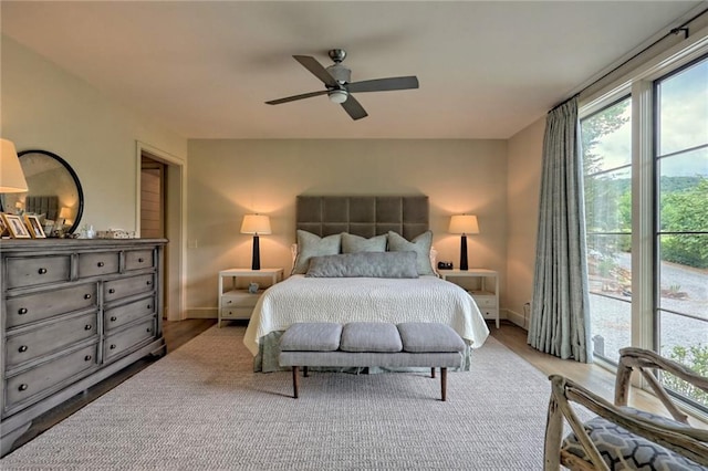 bedroom with hardwood / wood-style flooring and ceiling fan