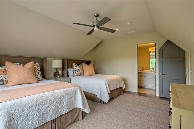 carpeted bedroom featuring ensuite bathroom, ceiling fan, and lofted ceiling