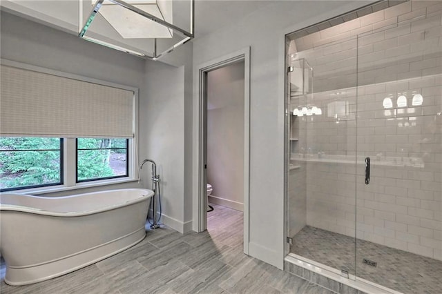 bathroom with plus walk in shower and toilet