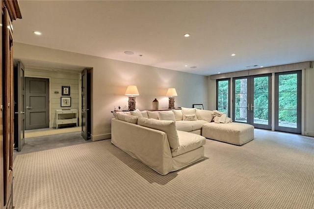 living room featuring light carpet and french doors