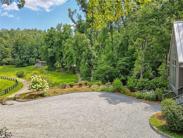 view of property's community featuring a lawn