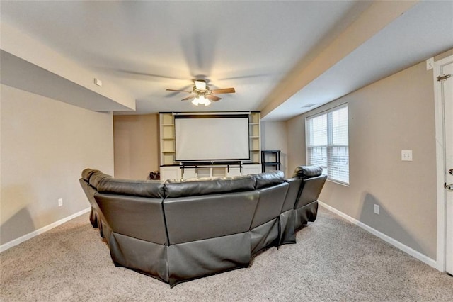 cinema featuring carpet flooring, ceiling fan, and baseboards