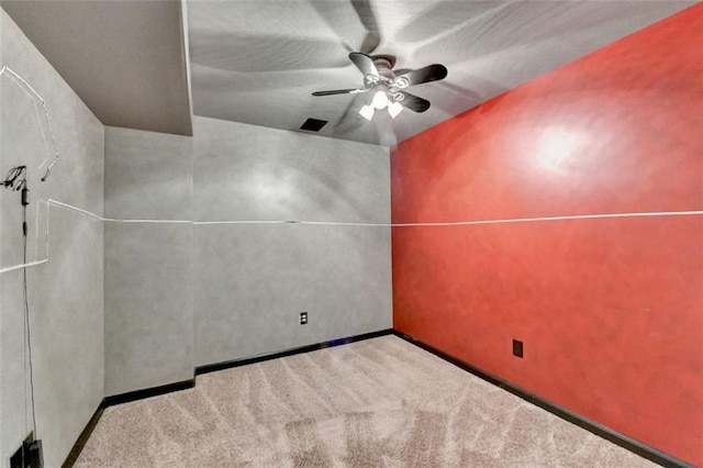 unfurnished room featuring carpet floors and a ceiling fan