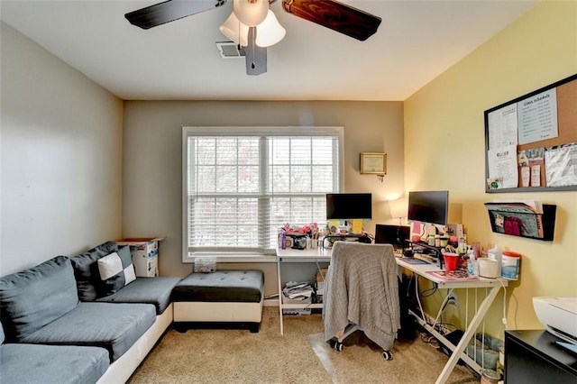 office area with light carpet, ceiling fan, and visible vents