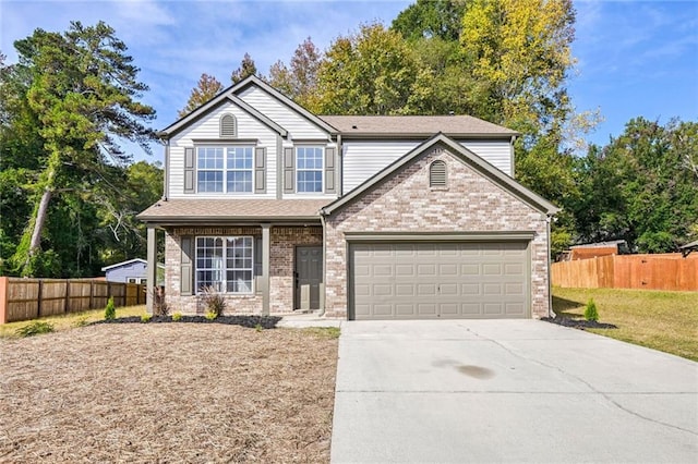 front of property featuring a front yard and a garage