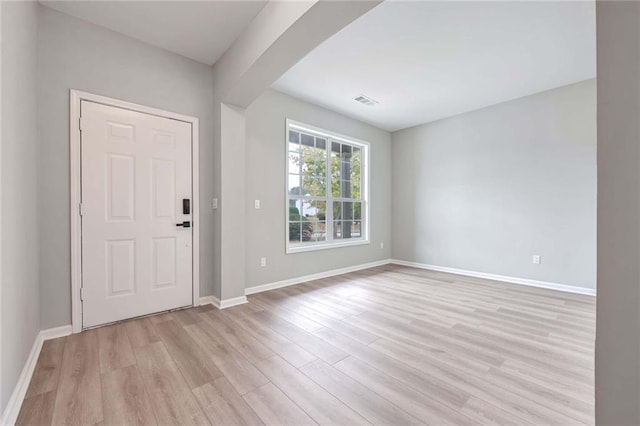 entrance foyer with light hardwood / wood-style flooring