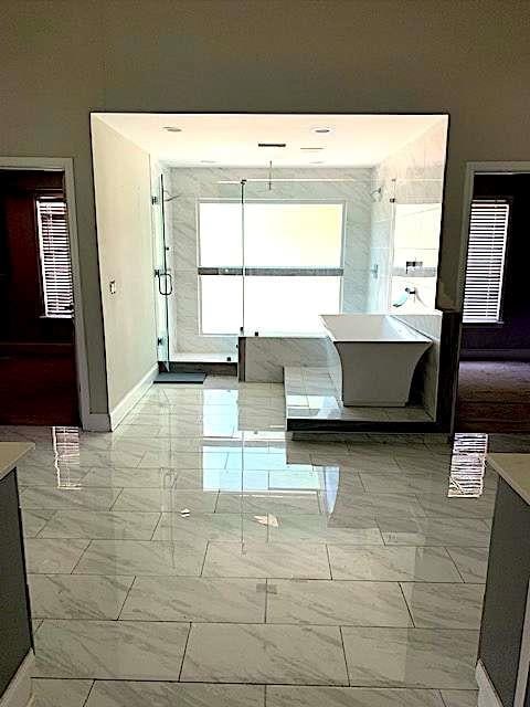 168 Harmony Grove Rd, Lilburn, GA 30047 - bathroom with marble finish floors, baseboards, and vanity