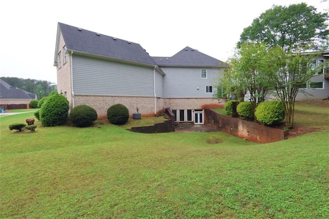 168 Harmony Grove Rd, Lilburn, GA 30047 - back of property featuring a lawn