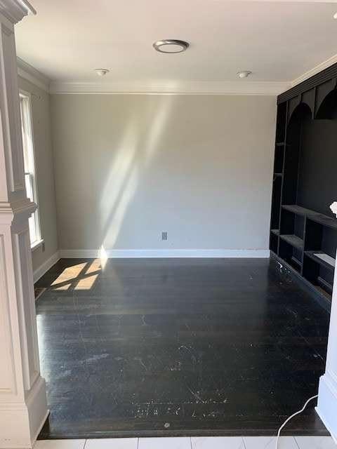 168 Harmony Grove Rd, Lilburn, GA 30047 - spare room with ornamental molding and baseboards