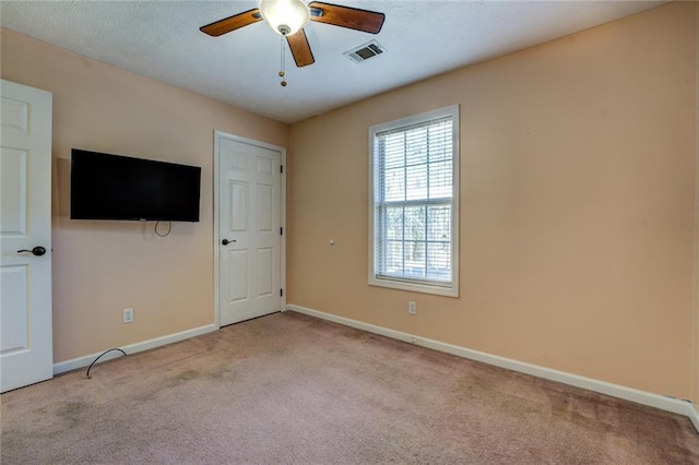 1240 H D Atha Rd, Monroe, GA 30655 - unfurnished bedroom with carpet, visible vents, a ceiling fan, and baseboards