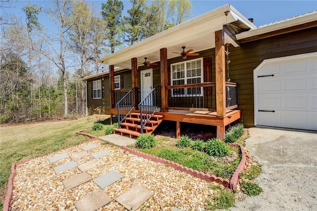 1240 H D Atha Rd, Monroe, GA 30655 - view of front of property with a ceiling fan, an attached garage, and concrete driveway