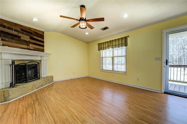 1240 H D Atha Rd, Monroe, GA 30655 - unfurnished living room featuring baseboards, visible vents, a ceiling fan, wood finished floors, and crown molding