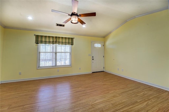 1240 H D Atha Rd, Monroe, GA 30655 - unfurnished living room featuring wood finished floors, visible vents, ceiling fan, and crown molding