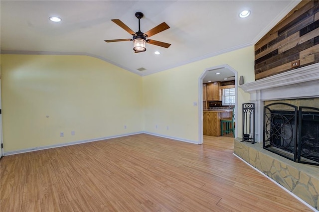 1240 H D Atha Rd, Monroe, GA 30655 - unfurnished living room with light wood finished floors, baseboards, ceiling fan, and crown molding