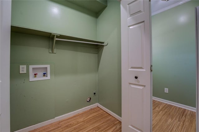 1240 H D Atha Rd, Monroe, GA 30655 - laundry room with washer hookup, light wood-style flooring, laundry area, and hookup for an electric dryer