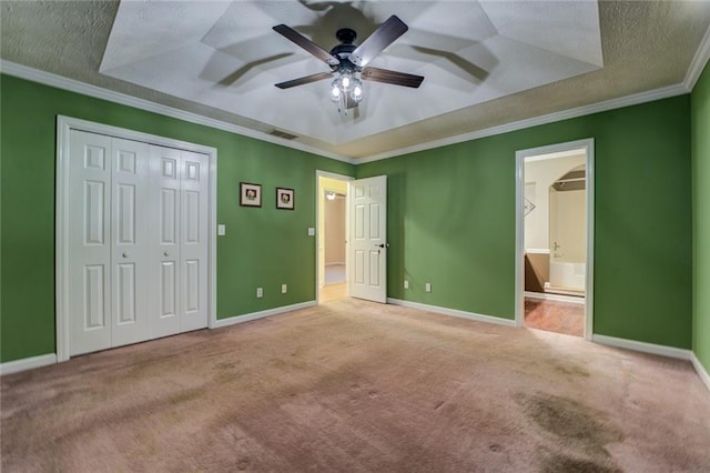 1240 H D Atha Rd, Monroe, GA 30655 - unfurnished bedroom featuring a tray ceiling, a textured ceiling, and visible vents