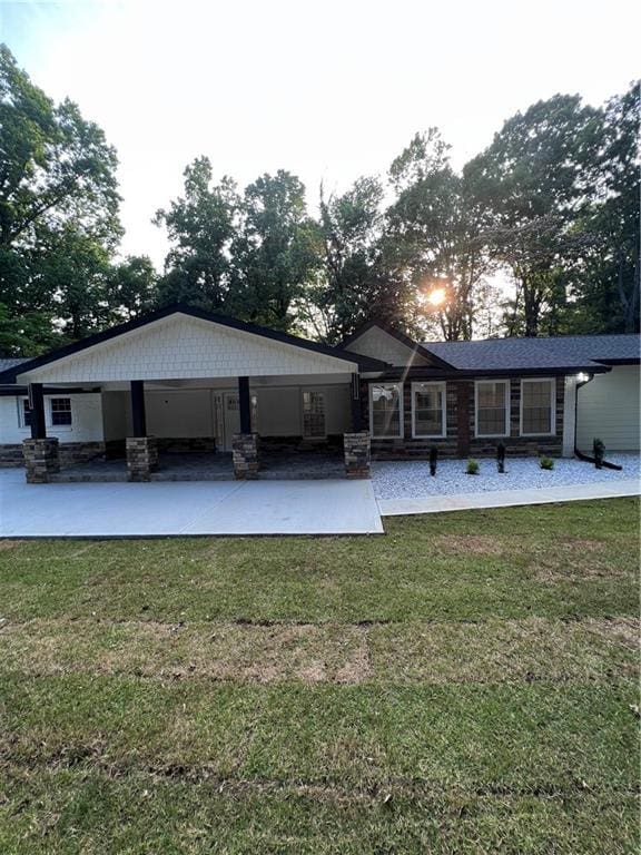 rear view of property with a yard