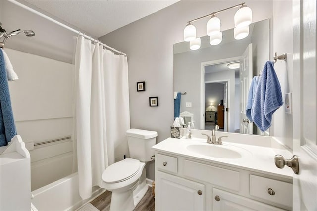 full bathroom with vanity, toilet, wood-type flooring, and shower / tub combo