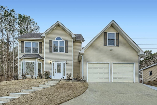 traditional home featuring concrete driveway