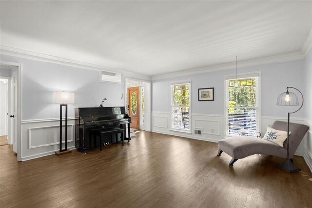 dining area featuring ornamental molding, an inviting chandelier, and dark hardwood / wood-style floors