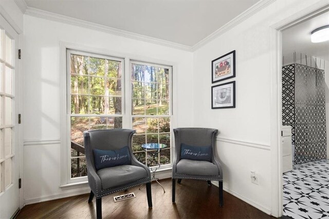 living room featuring dark hardwood / wood-style flooring and crown molding