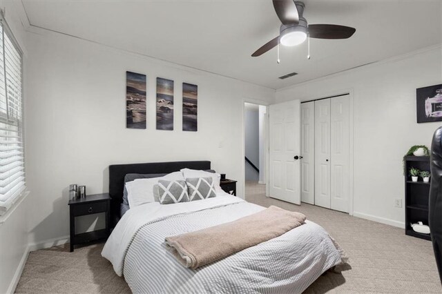 carpeted office space with ceiling fan, lofted ceiling, and ornamental molding