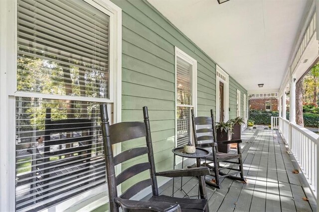 back of house with a sunroom