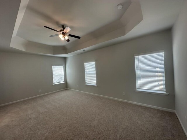 bathroom featuring a shower stall, a bath, and baseboards