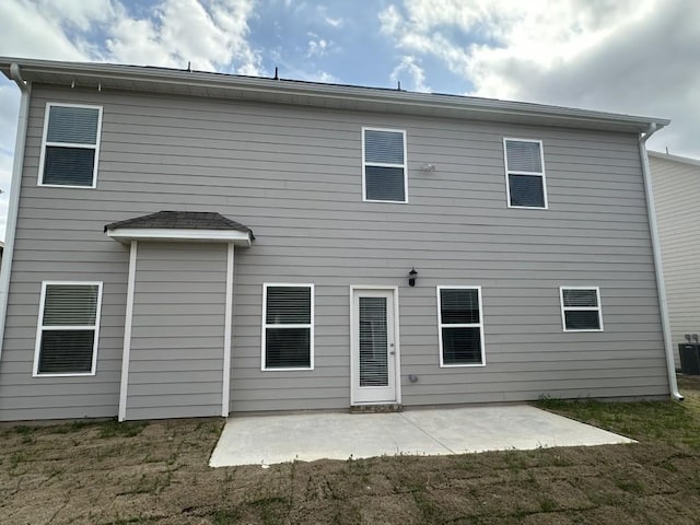 rear view of house with a patio and central air condition unit