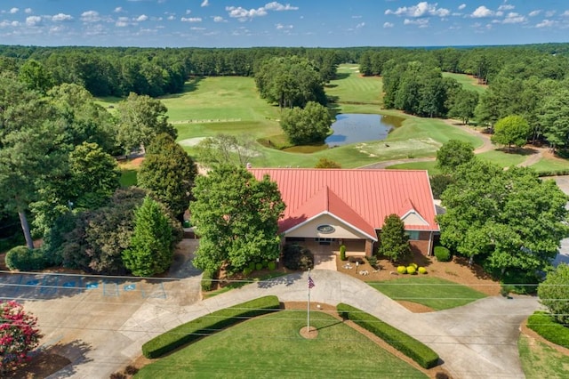 bird's eye view with a water view and a view of trees