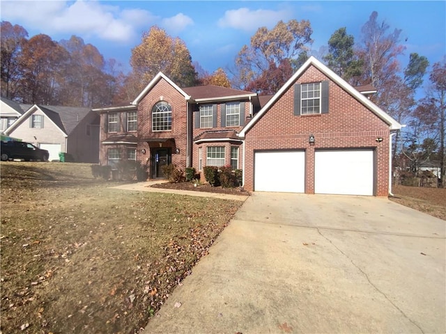 front of property with a garage and a front lawn