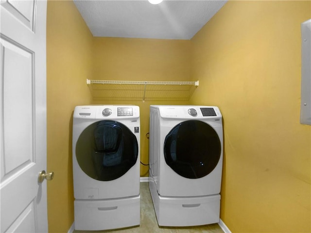 washroom with washing machine and dryer