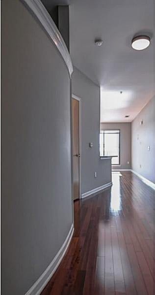 hallway featuring dark hardwood / wood-style floors