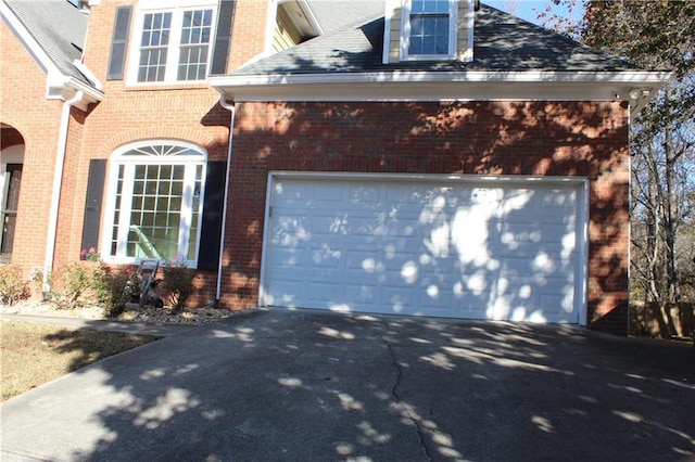 view of side of property with a garage