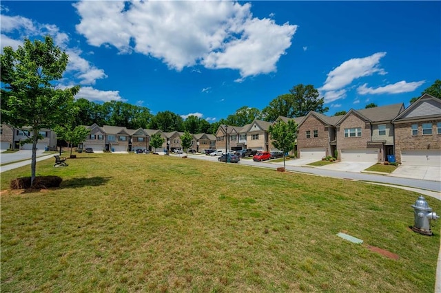 221 Irwell Path, Lawrenceville, GA 30044 - view of grassy yard featuring a residential view and an attached garage
