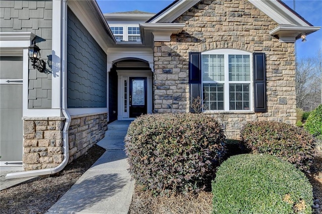 doorway to property with stone siding