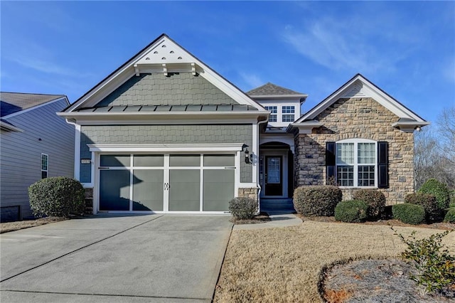 craftsman house featuring an attached garage, stone siding, and concrete driveway