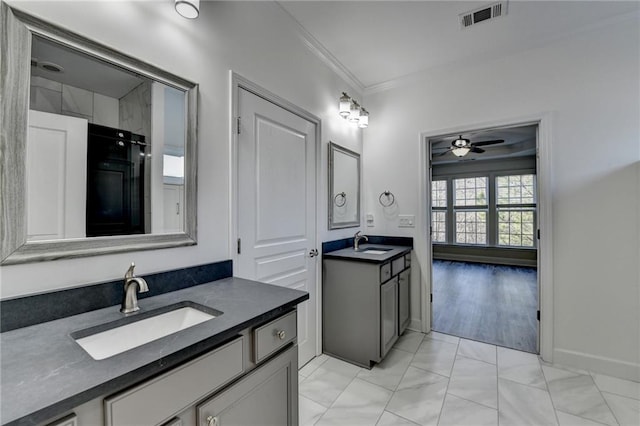 bathroom with two vanities, a sink, visible vents, and crown molding