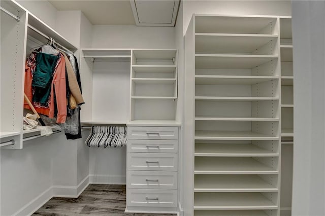 spacious closet with wood finished floors