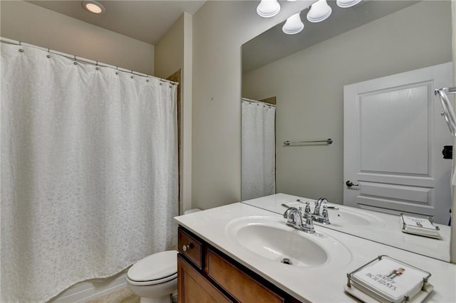 full bath with vanity and toilet