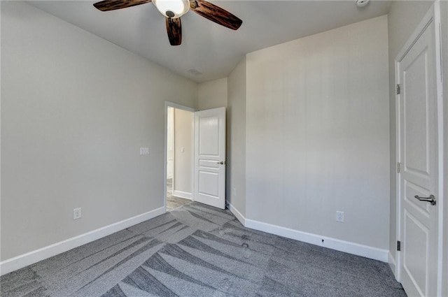 unfurnished bedroom featuring ceiling fan, carpet flooring, and baseboards